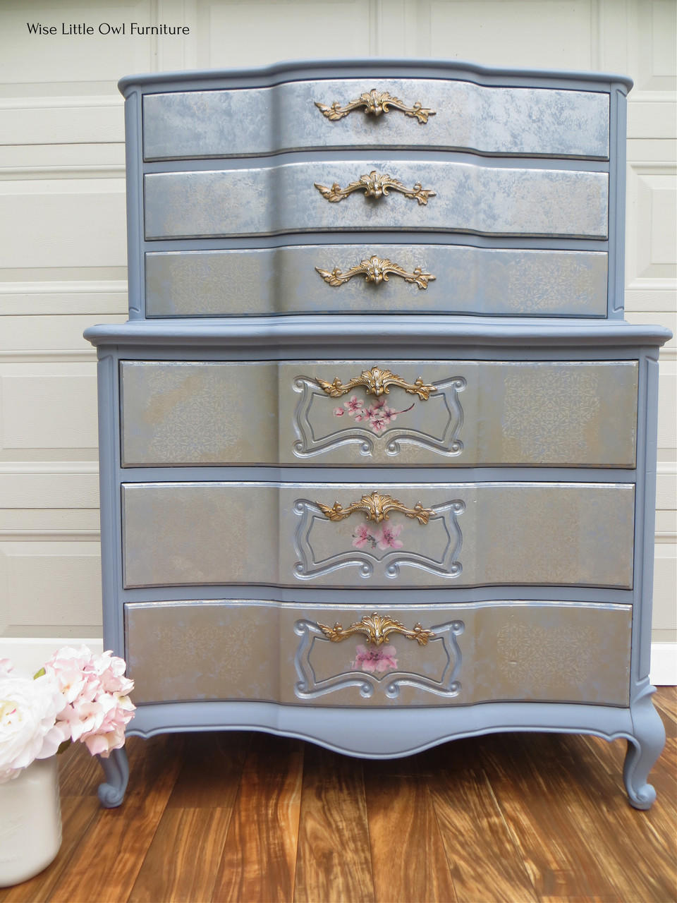 Quiet Cove Silk All-In-One paint is perfect for painting kitchen cabinets, bathroom cabinets and painting furniture! A vintage dresser with the top being slightly smaller than the body of the dresser but has 3 drawers on each level, 6 drawers in total. Featuring this medium-gray paint throughout the whole dresser and gold Victorian style hardware and cherry blossoms on the bottom 3 drawers.