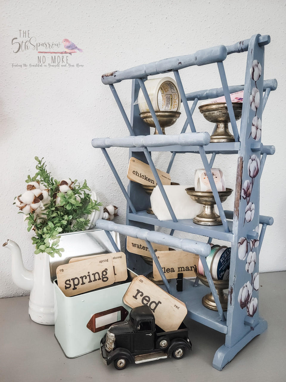 Quiet Cove Silk All-In-One paint is perfect for painting kitchen cabinets, bathroom cabinets and painting furniture! An old magazine painted in this medium-gray paint with our cotton and eucalyptus transfer down the sides and staged with various farmhouse décor.