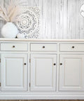 Salt Water Silk All-In-One paint is perfect for painting kitchen cabinets, bathroom cabinets and painting furniture. White painted buffet with bronze knobs.