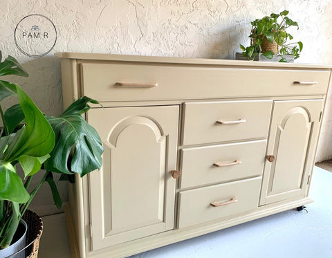 Silk All-In-One Mineral Paint Sand Castle Silk Paint  is perfect for painting kitchen cabinets, bathroom cabinets and painting furniture! A dresser that is painted in sand castle with natural looking hardware.