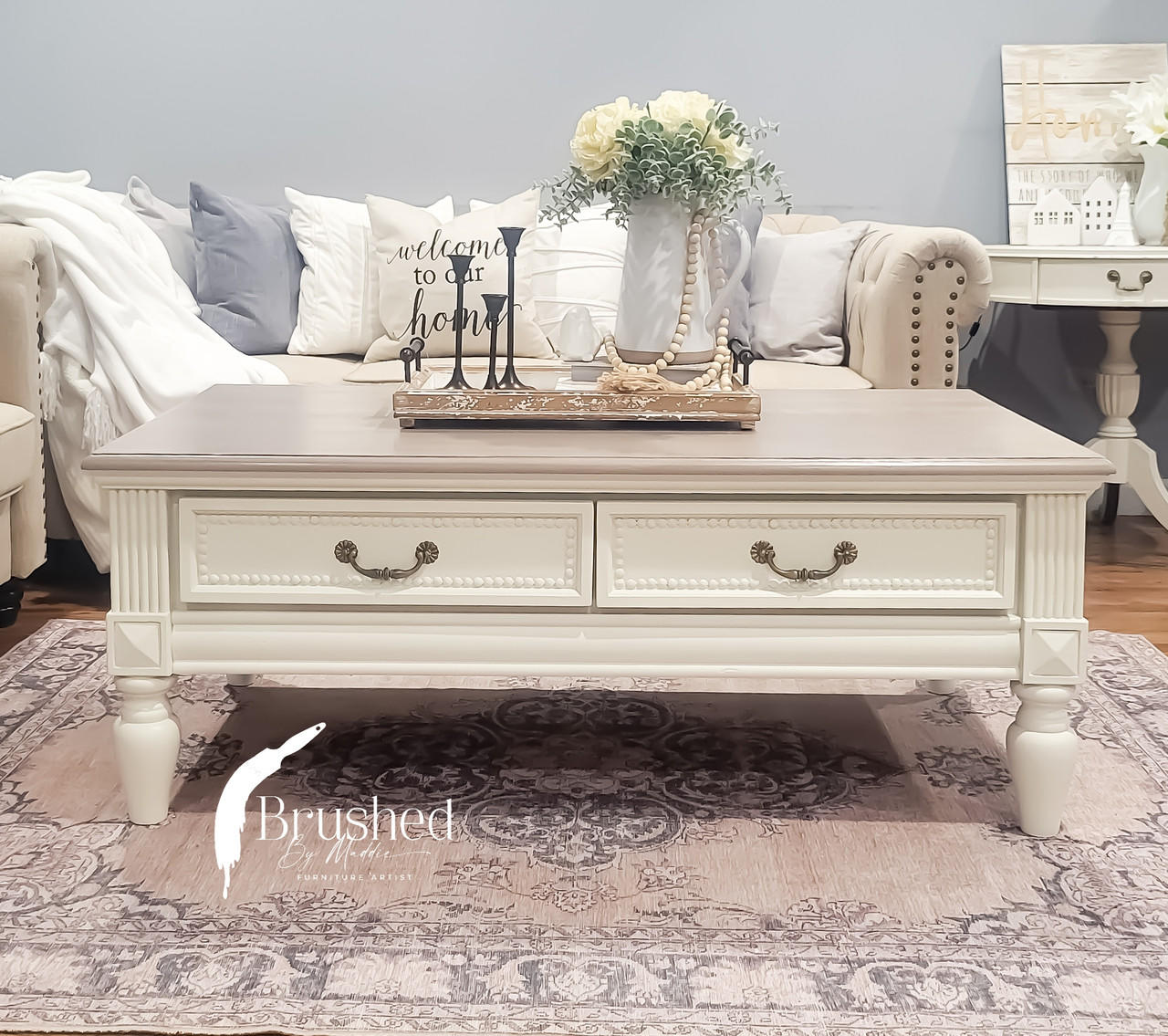 Silk All-In-One Mineral Paint Sand Castle Silk Paint  is perfect for painting kitchen cabinets, bathroom cabinets and painting furniture! A coffee table that is painted in sand castle and has 2 drawers on the front.