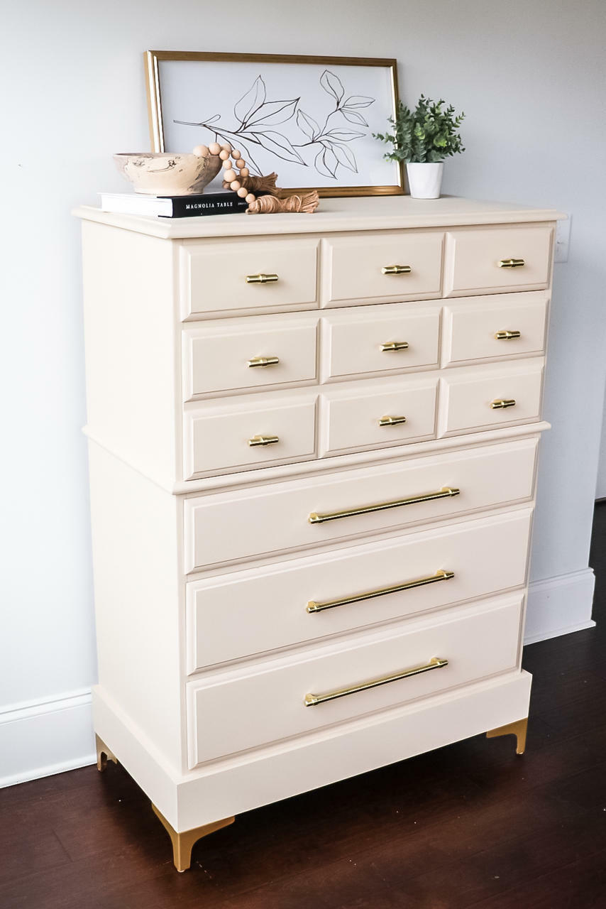 Sand Castle Silk All-In-One paint is perfect for painting kitchen cabinets, bathroom cabinets and painting furniture! A tall dresser painted in sand castle and has gold hardware. This dresser has 12 drawers, 9 small ones on the top half and 3 long ones on the bottom.