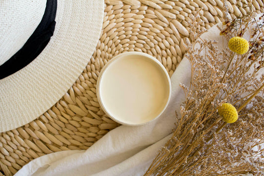 Sand Castle Silk All-In-One paint is perfect for painting kitchen cabinets, bathroom cabinets and painting furniture! An image of an open jar of paint, sand castle. The paint jar is staged with various staging props.