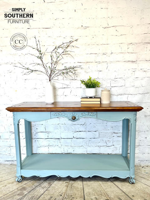 Serenity Silk All-In-One paint is perfect for painting kitchen cabinets, bathroom cabinets and painting furniture! A hallway table painted in serenity with a rich dark wood top.