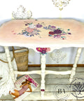 Sun Kissed Silk All-In-One paint is perfect for painting kitchen cabinets, bathroom cabinets and painting furniture.
console table painted in Sun Kissed Silk All-In-One paint  with the top blended with a pink and it has the Flower Child - Transfer on the top of the table. Staged with a woven bag and magazine under the table.