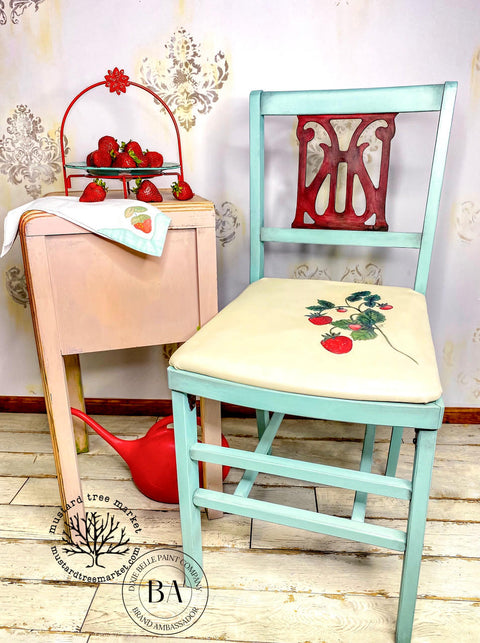 Sun Kissed Silk All-In-One paint is perfect for painting kitchen cabinets, bathroom cabinets and painting furniture.
Chair and tea table set with Sun Kissed Silk All-In-One paint as an accent colors on the chair. Staged with strawberries, the chair has strawberry vine drawn on the cushion