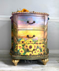 Belles and Whistles Sunflower Sunset - A1 Rice Decoupage Paper , three drawer side table with the sunflower sunset rice decoupage paper on the front.  staged with sunflowers on top