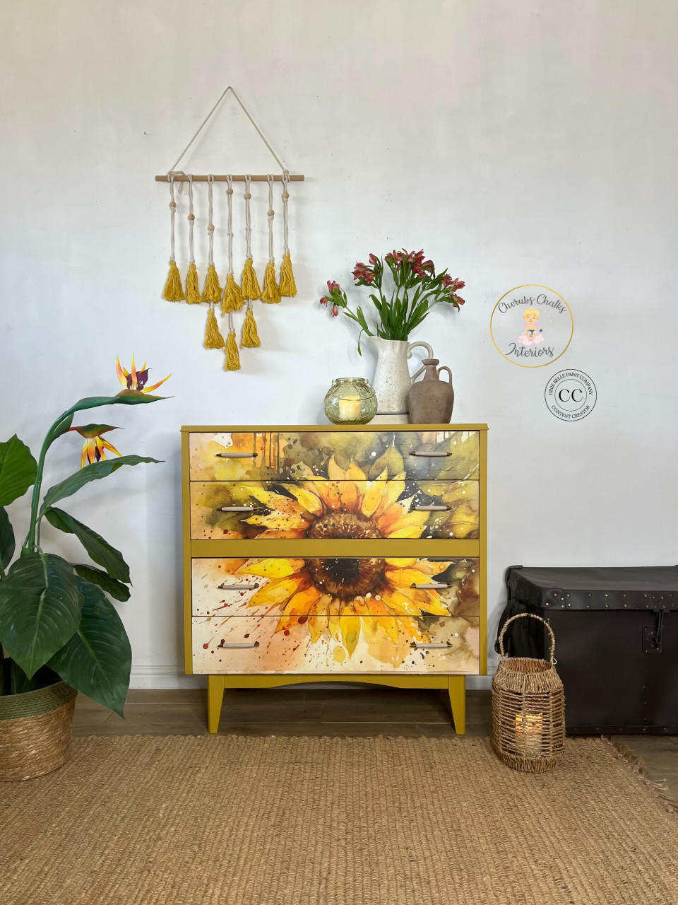 Cozy interior corner featuring a vibrant Sunny Daze A1 Rice Decoupage Paper-themed dresser, accompanied by a lush green plant, a vase with fresh flowers, and decorative items, creating a harmonious blend of nature-inspired decor and modern design.