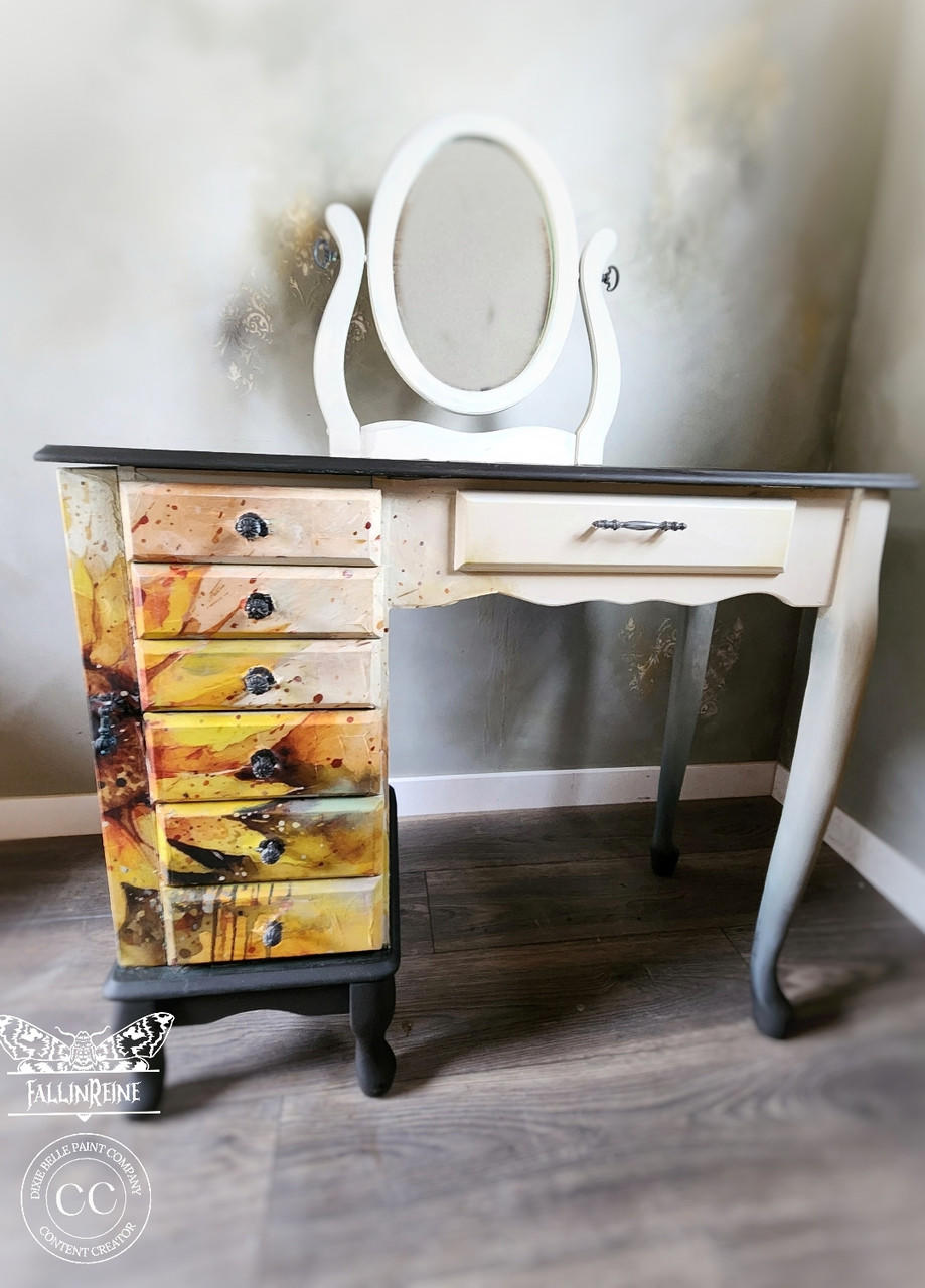 A vintage vanity table with Sunny Daze A1 Rice Decoupage Paper design on its drawers, set against a neutral wall and floor, adding a creative touch to the room.
