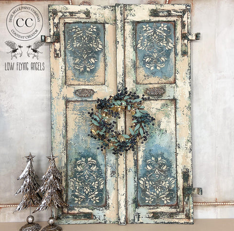 Terra Clay Paint Blue Agave Terra Clay Paint provides endless possibilities for your imagination and can be used on wood, canvas, tile, fabric and more! Distressed shutters painted and accented with blue agave Terra Clay Paint and patina products on the corners to give a rusted look. A blue and gold wreath  is used as a decor right in the center. Staged with two small bronze christmas trees.