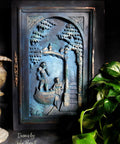 Blue Moon Terra Clay Paint provides endless possibilities for your imagination and can be used on wood, canvas, tile, fabric and more!
A 3D  black picture frame with Blue Moon Terra Clay Paint to accent the inside of art with gold accents on the high points.Staged with a black background and greenery.