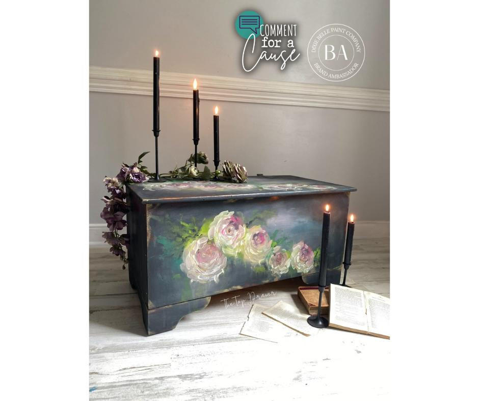 Bougainvillea Terra Clay Paint provides endless possibilities for your imagination and can be used on wood, canvas, tile, fabric and more!
Chest in a dark gray with hand painted white with hints of green and yellow flowers using Bougainvillea Terra Clay Paint as an accent inside flowers. Staged with tall black candles , faux flowers and books.