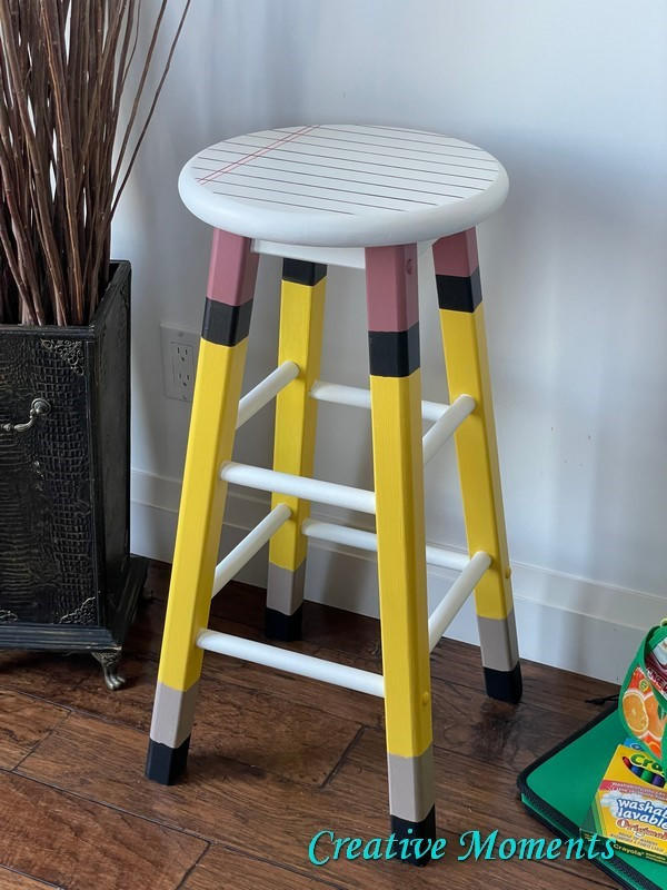 Terra Clay Paint Daffodil Terra Clay Paint provides endless possibilities for your imagination and can be used on wood, canvas, tile, fabric and more! A stool that resembles a note book and pencil. The top is white ans painted with lines like the notebook paper and the top of the legs are painted pink for the eraser, then painted in daffodil to resemble a pencil and then black on the bottom to resemble the lead.