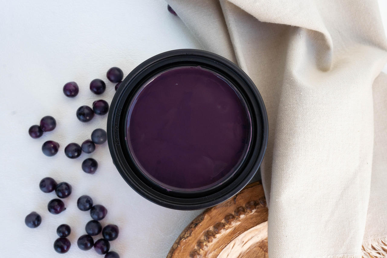 Elderberry Terra Clay Paint provides endless possibilities for your imagination and can be used on wood, canvas, tile, fabric and more! Open can of Elderberry Terra Clay Paint staged with berries and a white drop cloth.
