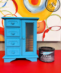 Lani's Lagoon Terra Clay Paint provides endless possibilities for your imagination and can be used on wood, canvas, tile, fabric and more!
Jewelry box painted in Lani's Lagoon Terra Clay Paint Staged on top of a red platform  and the 16 ounce container of Lani's Lagoon Terra Clay Paint besides piece.