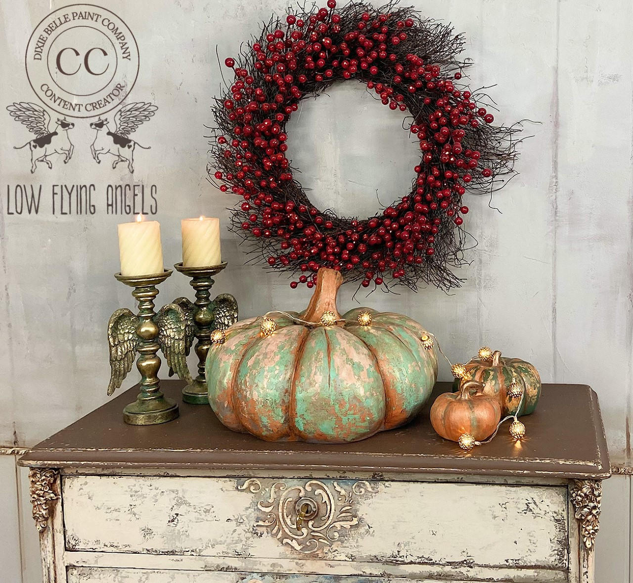 Marigold Terra Clay Paint provides endless possibilities for your imagination and can be used on wood, canvas, tile, fabric and more! Blue and gold Terra Clay Painted Pumpkins with gold. Staged with lights and a two candle sticks with candles.