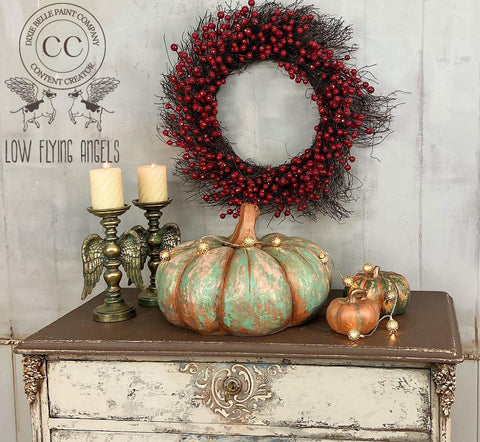 Marigold Terra Clay Paint provides endless possibilities for your imagination and can be used on wood, canvas, tile, fabric and more! Blue and gold Terra Clay Painted Pumpkins with gold. Staged with lights and a two candle sticks with candles.