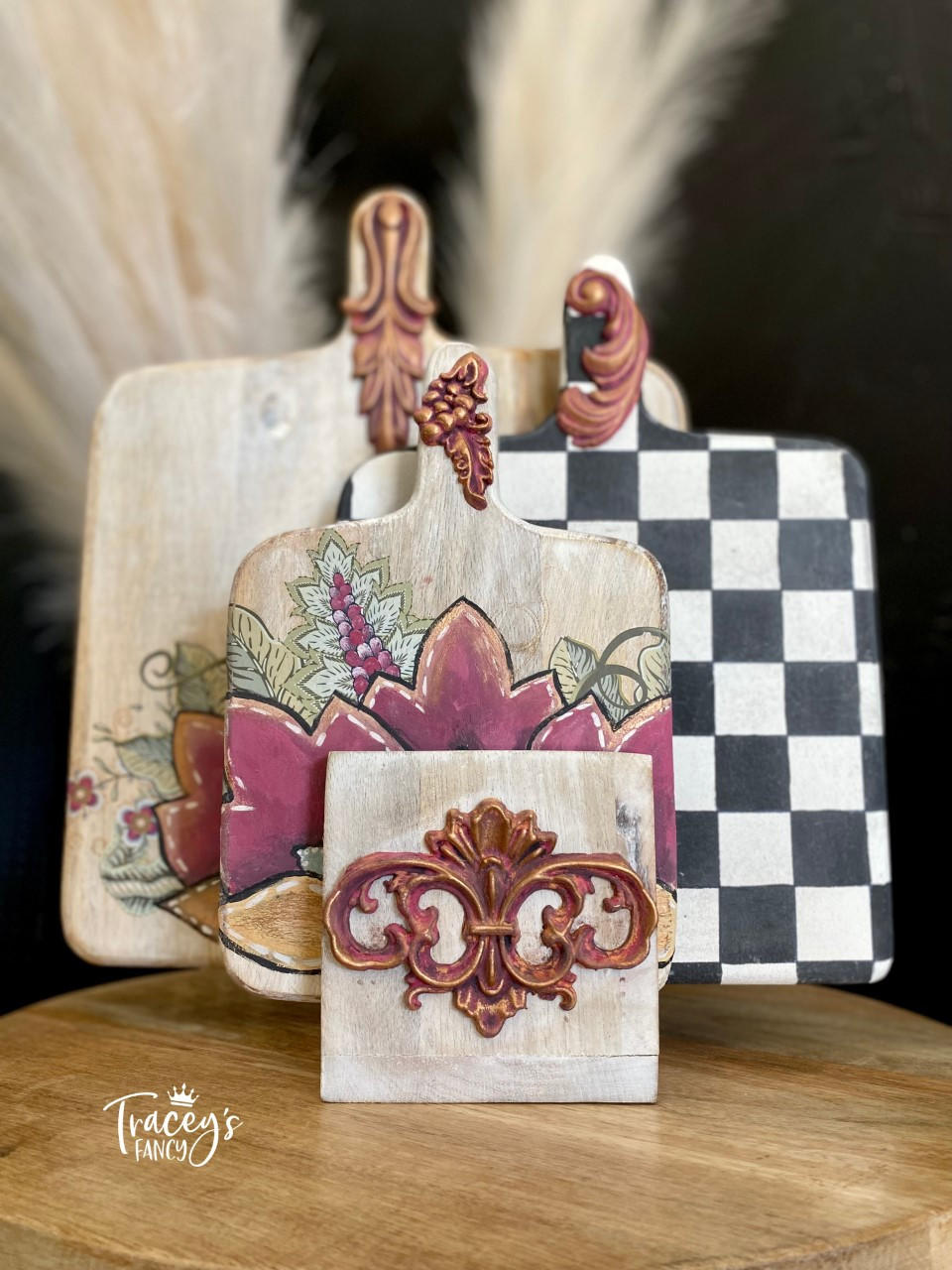 Moon Beam Terra Clay Paint provides endless possibilities for your imagination and can be used on wood, canvas, tile, fabric and more! Cutting boards painted with Cream terra paint with various floral designs and a checkerboard.