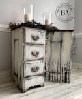 Onyx Terra Clay Paint provides endless possibilities for your imagination and can be used on wood, canvas, tile, fabric and more! End tables distressed and Painted cream and black with terra Paint and trees painted on the side. Staged with wreath and candles.
