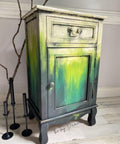 Onyx Terra Clay Paint provides endless possibilities for your imagination and can be used on wood, canvas, tile, fabric and more! Yellow, green and black clay painted end table blended together. Staged with a wood stick and black candle sticks.