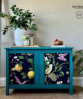 Blue painted dresser with the Vintage Botanical decoupage paper applied on the front of the cabinets.