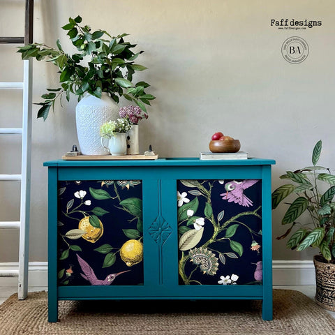 Blue painted dresser with the Vintage Botanical decoupage paper applied on the front of the cabinets.
