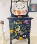 Navy blue painted nightstand with a gold handle. The Vintage Botanical decoupage paper was applied on the front of the nightstand.