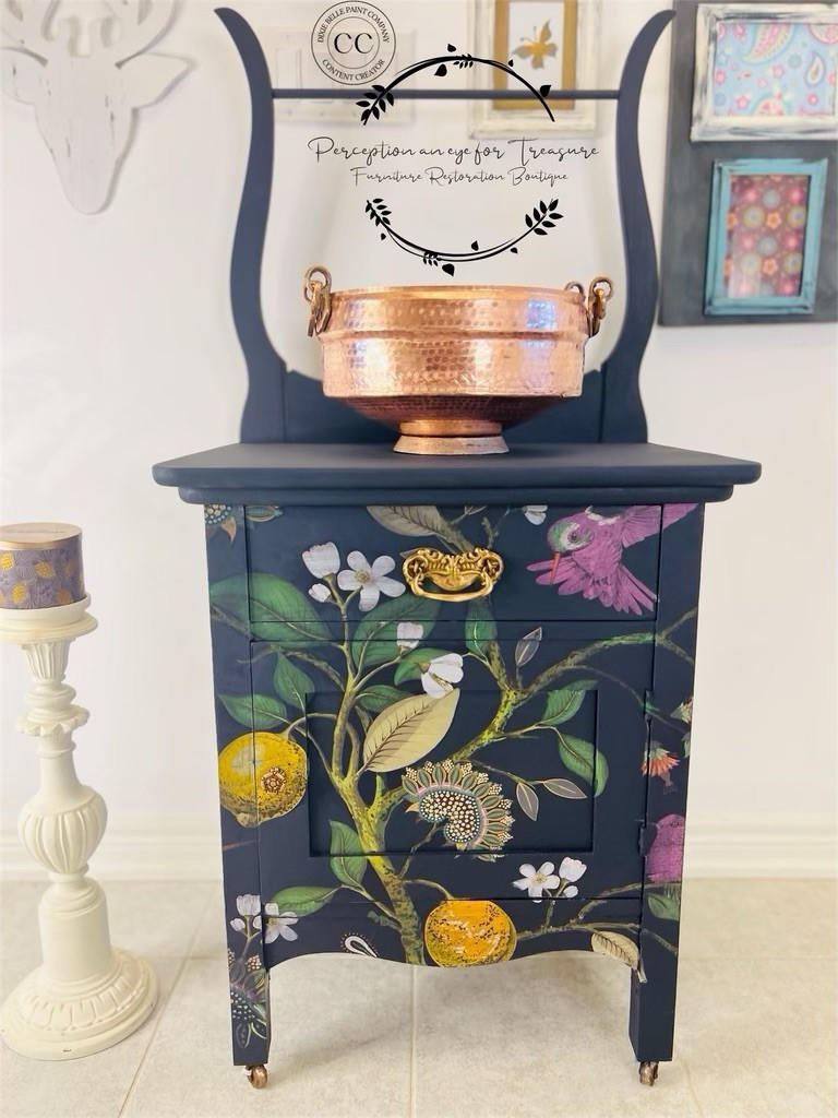 Navy blue painted nightstand with a gold handle. The Vintage Botanical decoupage paper was applied on the front of the nightstand.