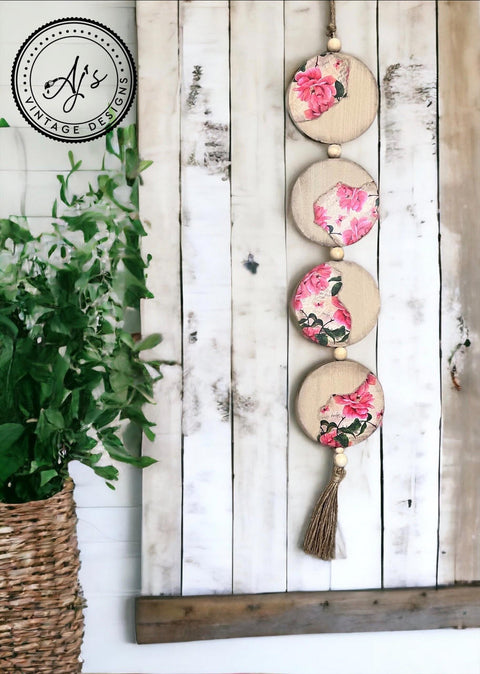 White and brown painted wooden slat board with 4 small beaded wooden circles hanging with the Vintage Wallpaper decoupage paper applied on parts of the circles.