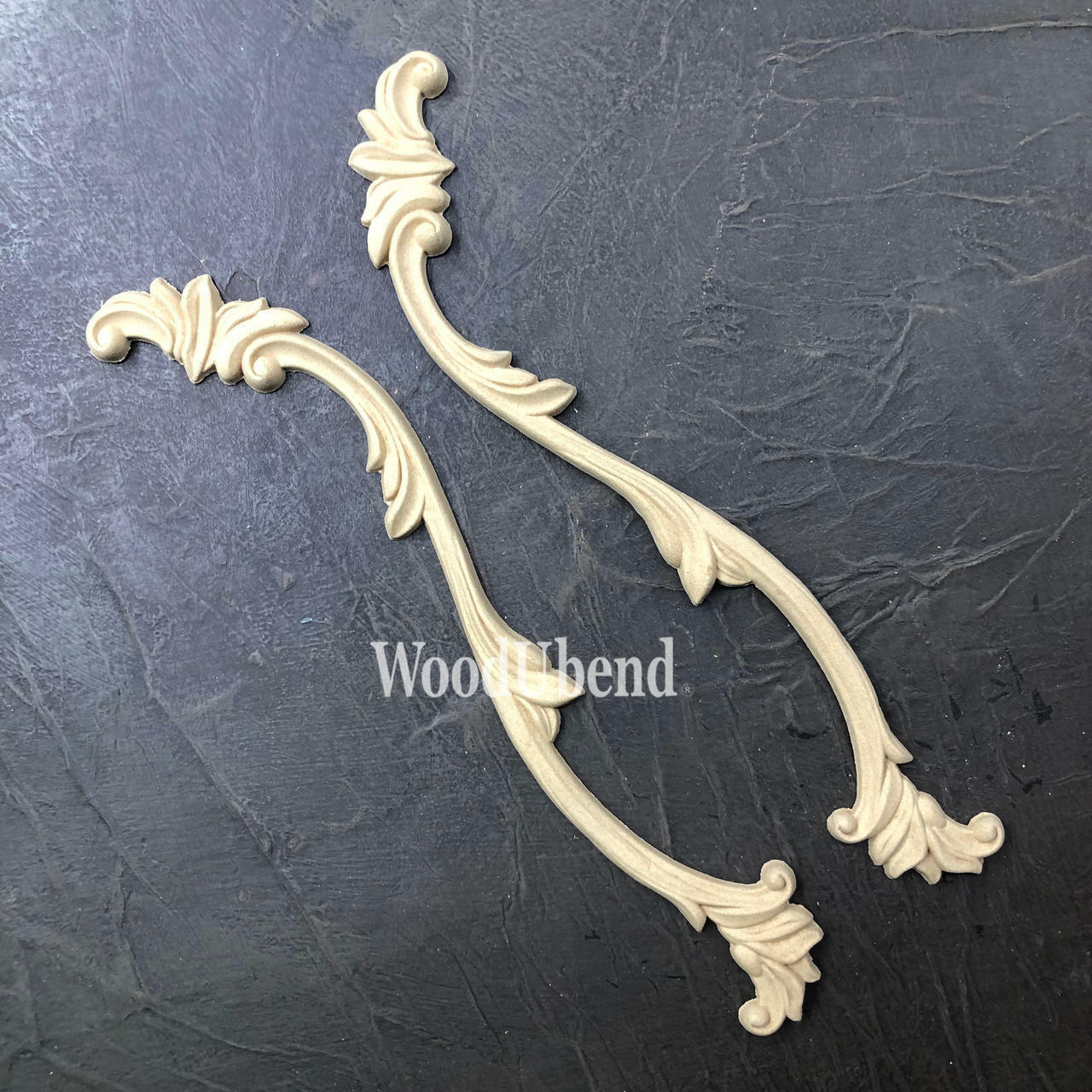 WoodUBend Applique #1245.26 (set of 2) is the perfect mouldable embellishment for any project! Applique #1245.26 against black background. Shows 2 molds.