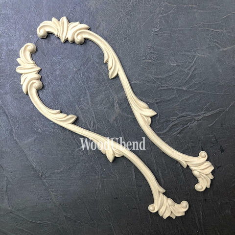 WoodUBend Applique #1245.26 (set of 2) is the perfect moludable embellishment for any project! Applique #1245.26 against black background. Shows 2 molds.