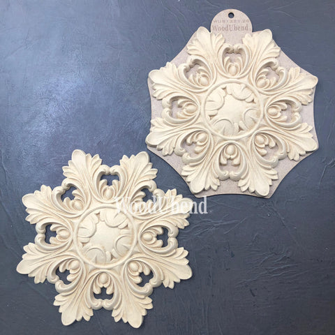 WoodUBend Applique #1323.26 (Set of 2) is the perfect mouldable embellishment for any project! Applique #1323.26 (Set of 2) with packaging against black background.