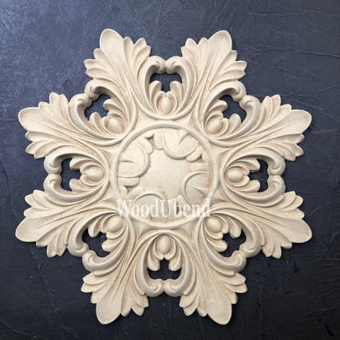 WoodUBend Applique #1323.26 (Set of 2) is the perfect mouldable embellishment for any project! Image of one Applique #1323.26 against black background.