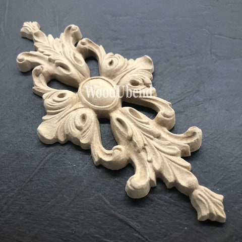 WoodUBend Applique #1339 (Set of 2) is the perfect mouldable embellishment for any project! Image of one Applique #1339 against black background.