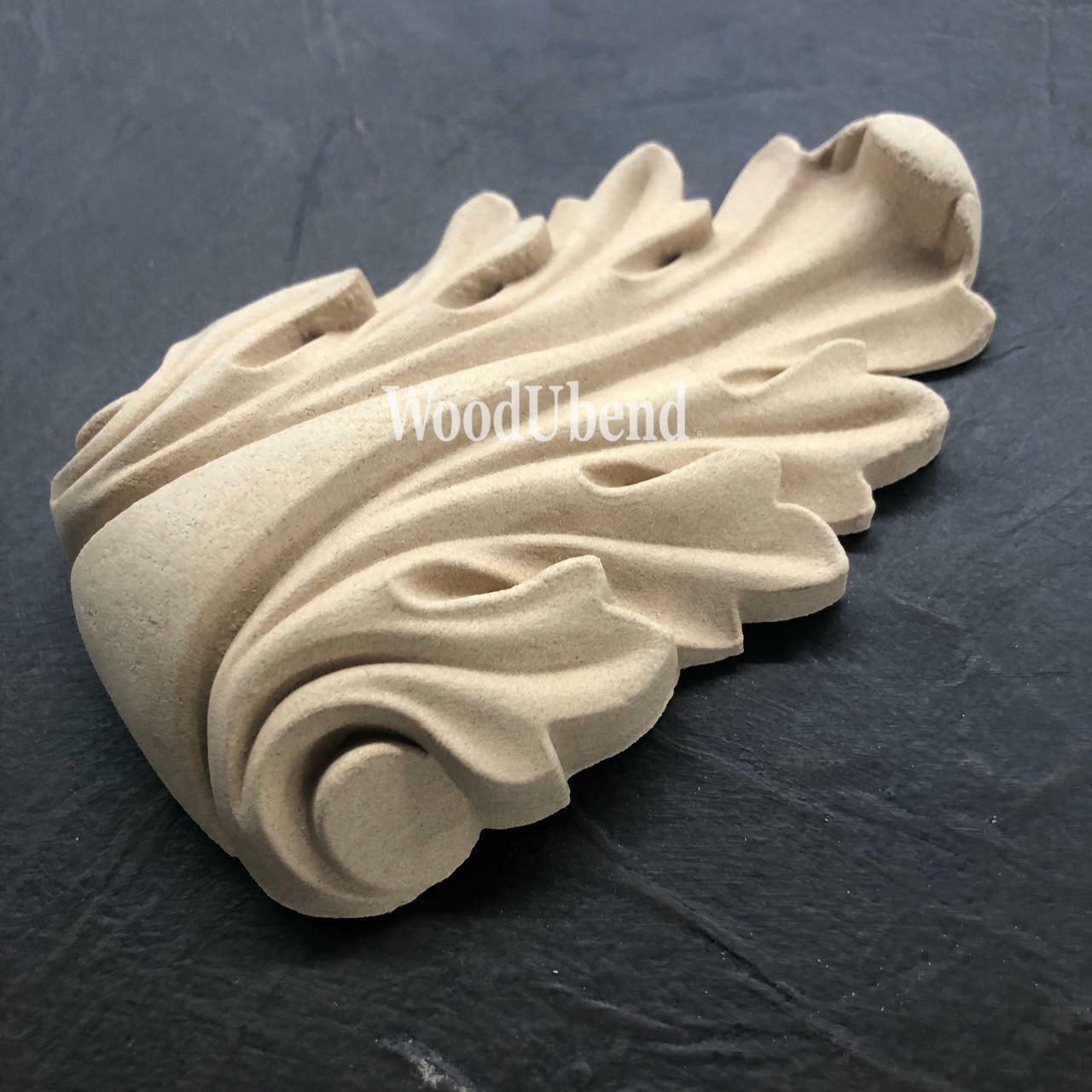 WoodUBend Applique #1361 (Set of 2) is the perfect mouldable embellishment for any project! This image shows one Applique #1361 without packaging against a black background.