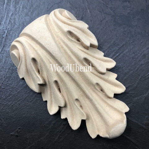 WoodUBend Applique #1361 (Set of 2) is the perfect mouldable embellishment for any project! This image shows one Applique #1361 without packaging against a black background.