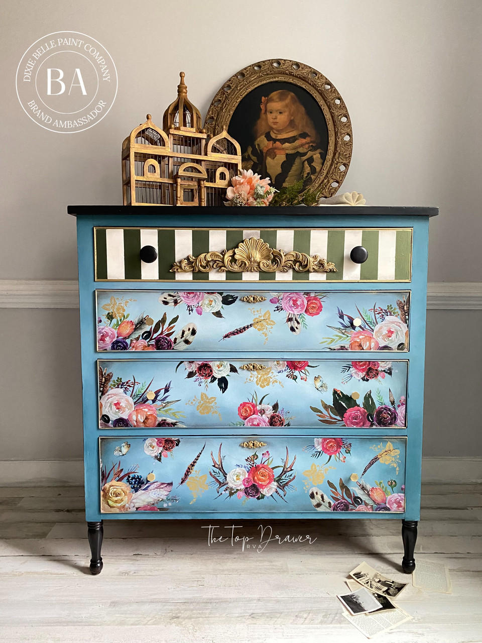 WoodUBend Applique #1372.48 (Set of 2) is the perfect mouldable embellishment for any project! Applique #1372.48 (Set of 2) mounted to the top drawer of a dresser painted with Dixie Belle Chalk Mineral Paint. The bottom 3 drawers are painted in a light blue while the top drawer is green and white with gold accents and Applique #1372.48 (Set of 2).