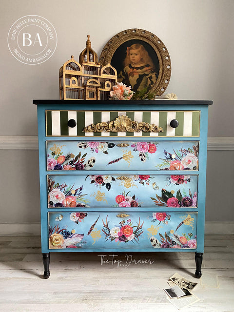 WoodUBend Applique #1372.48 (Set of 2) is the perfect mouldable embellishment for any project! Applique #1372.48 (Set of 2) mounted to the top drawer of a dresser painted with Dixie Belle Chalk Mineral Paint. The bottom 3 drawers are painted in a light blue while the top drawer is green and white with gold accents and Applique #1372.48 (Set of 2).