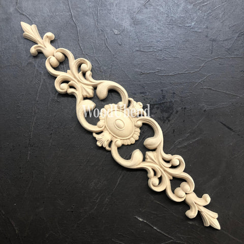 WoodUBend Applique #1374 (Set of 2) is the perfect mouldable embellishment for any project! Image shows one WoodUBend Applique #1374 against a black background.