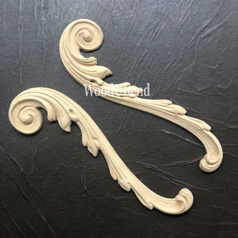 WoodUBend Applique #1723 (set of 2) is the perfect mouldable embellishment for any project!
Applique #1723 are seen both out of the packing, staged on a black crinkled background.