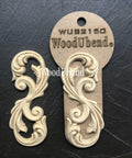 WoodUBend Applique #2150 (Set of 2) is the perfect mouldable embellishment for any project!
The Applique #2150 (Set of 2) is seen with one in a packaging and one without, staged on top of a black crinkled background.