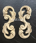 WoodUBend Applique #2150 (Set of 2) is the perfect mouldable embellishment for any project!
Applique #2150 (Set of 2) is seen side by side staged on top of a black crinkled background.