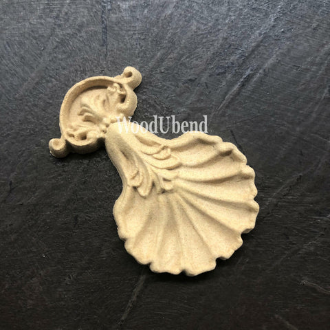 WoodUBend Applique #2447 (set of 2) is the perfect mouldable embellishment for any project!
One of the Applique #2447 (set of 2) staged out of its packaging and on a black crinkled background.