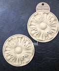 WoodUBend Applique #6013 (Set of 2) is the perfect moludable embellishment for any project! This image shows Applique #6013 (Set of 2) against a blackground with its packaging. 2 to a set.