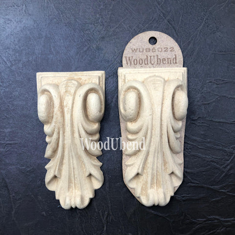 WoodUBend Applique #6022 (Set of 2) is the perfect mouldable embellishment for any project! Applique #6022 (Set of 2) with packaging against a black background.