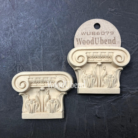 WoodUBend Applique #6079 (Set of 2) is the perfect mouldable embellishment for any project!
The Applique #6079 (Set of 2) is seen with one in a packaging and one without. Stage on top of a black crinkled background.