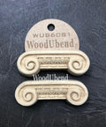 WoodUBend Applique #6081 (Set of 2) is the perfect mouldable embellishment for any project!
The Applique #6081 (Set of 2) is seen with one in a packaging and one without. Stage on top of a black crinkled background.