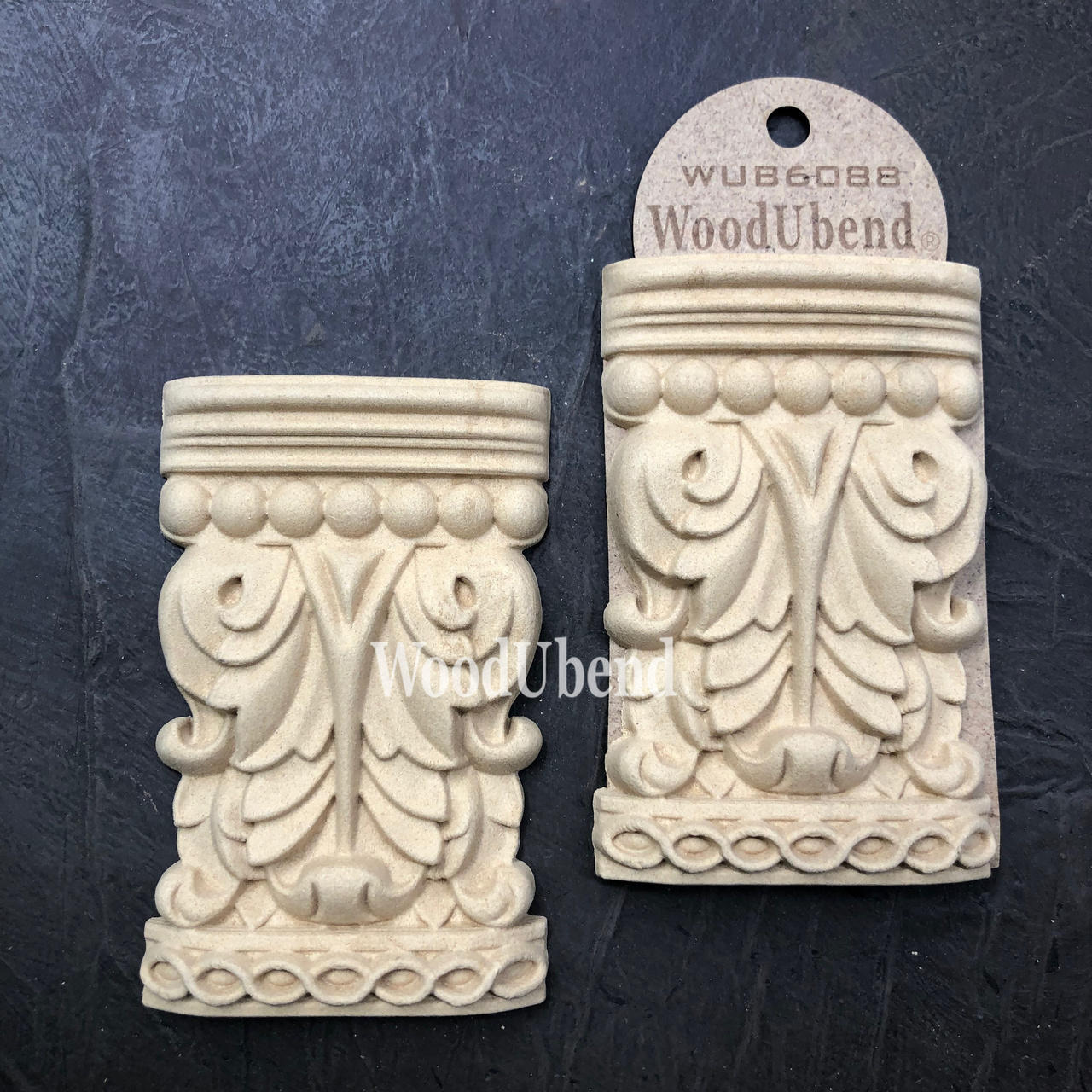 WoodUBend Applique #6088 (Set of 2) is the perfect mouldable embellishment for any project!
Applique #6088 (Set of 2) is seen with one in a packaging and one without. Stage on top of a black crinkled background.