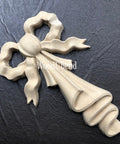 WoodUBend Bow Applique #X1012 (set of 2) is the perfect mouldable embellishment for any project!
This is a single bow laid diagonally on crinkled, black leather.  The bow has folded linen hanging down from the center of the bow.  The entire piece is beige.