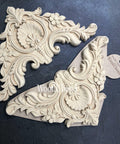 WoodUBend Corner Applique #1354.29 (Set of 2) is the perfect mouldable embellishment for any project!
This is a wood corner applique that can be secured to any piece of furniture.  This applique had a fan in the center and two flowers on either side of the fan.  It has a Victorian look with lots of "gingerbread" frills all over the corner applique.  This picture shows the two that come in a pack.  These appliques on resting on top of black leather.